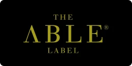 Logo on a black background capital letters  in gold